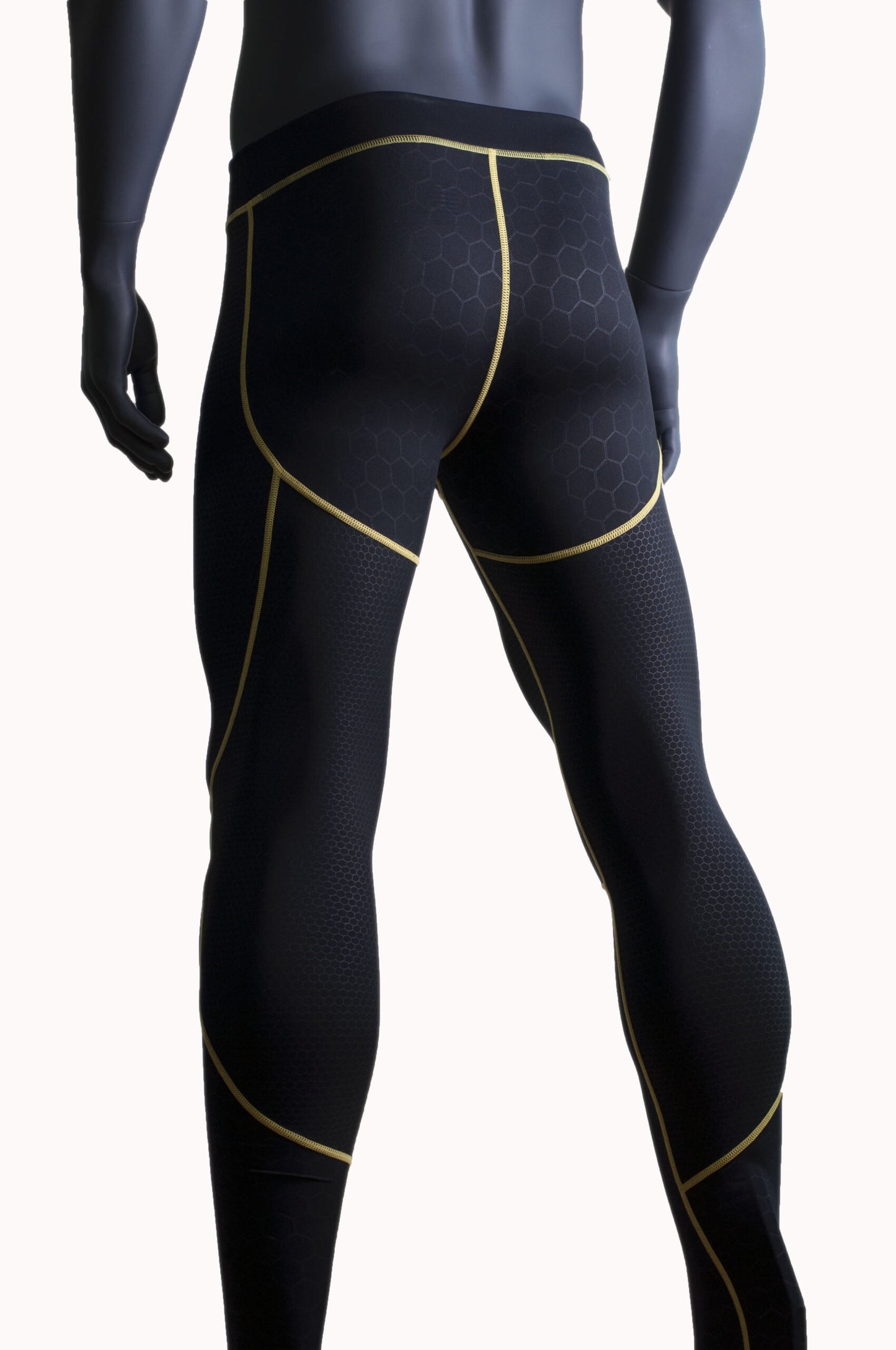 Night Prowler Apparel Black men's leggings with yellow piping and raised honeycomb textured patterns Back view