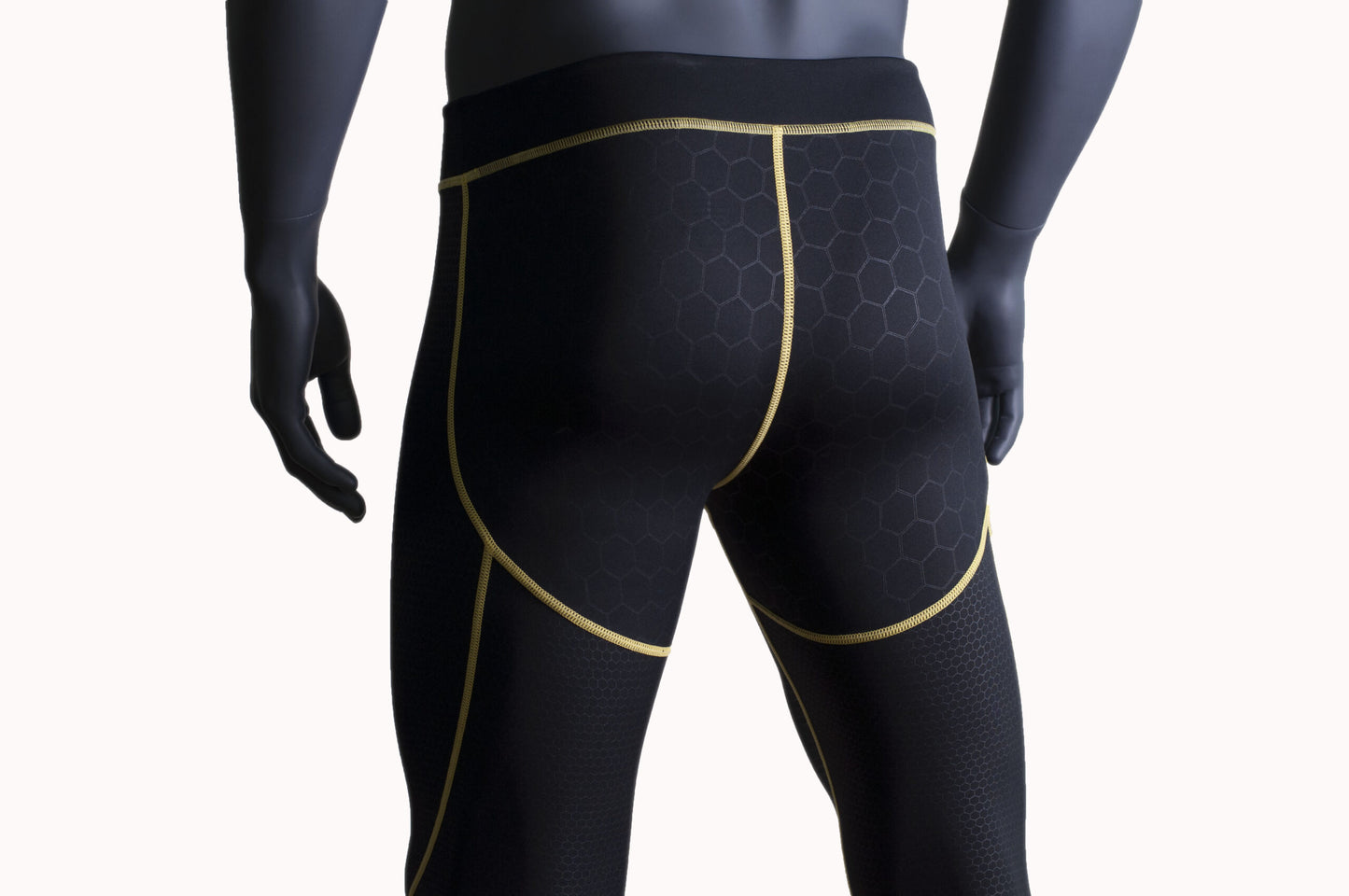 Night Prowler Apparel Black men's leggings with yellow piping and raised honeycomb textured patterns Back view