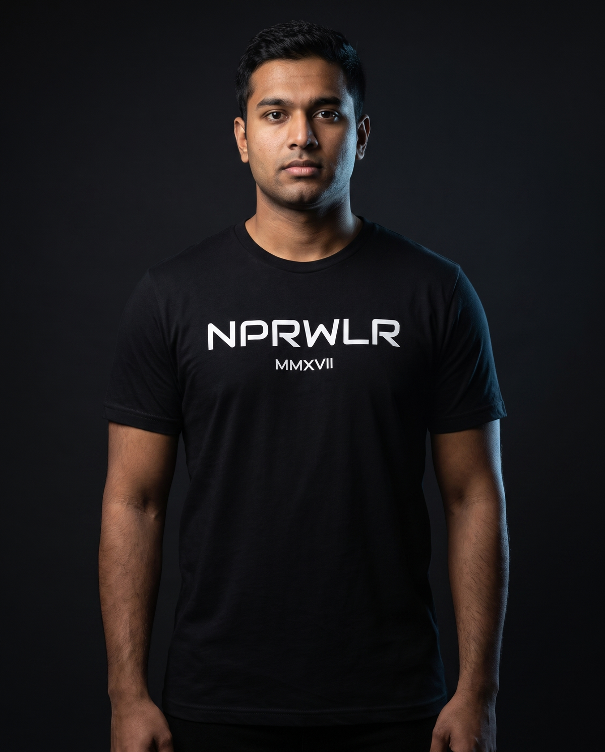 Model wearing the NPRWLR T-Shirt in black, front view with the chest print