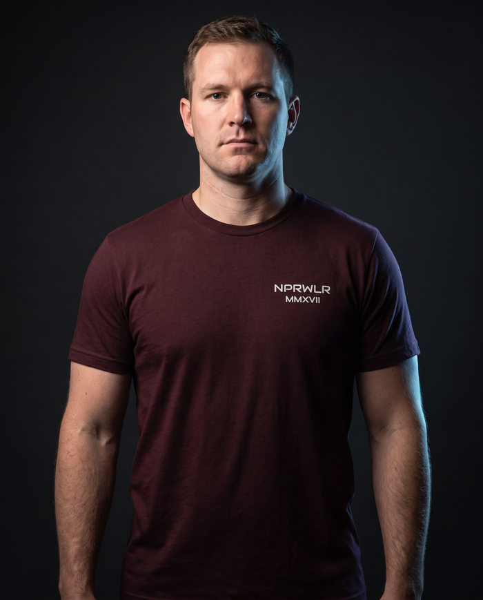 Model wearing the NPRWLR MMXVII T-Shirt in oxblood, front view with the chest print