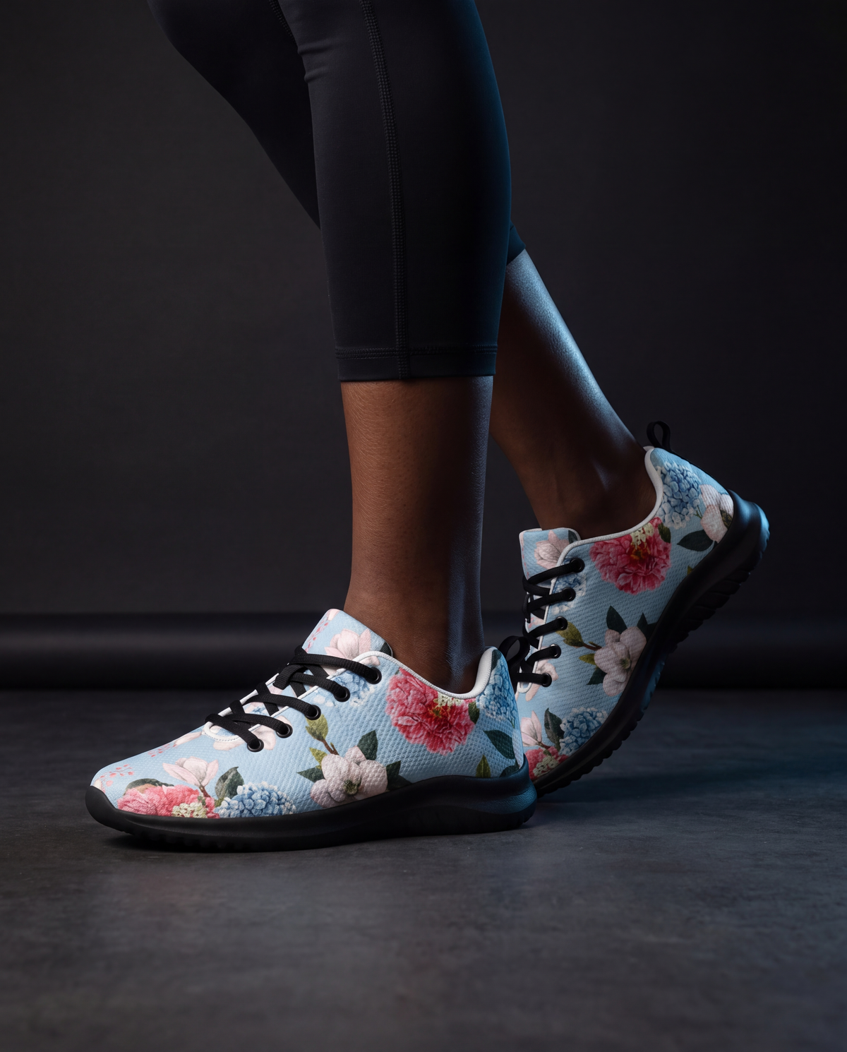 NPRWLR Floral Pattern Athletic Runners in black worn on a model, side profile showing the floral print upper